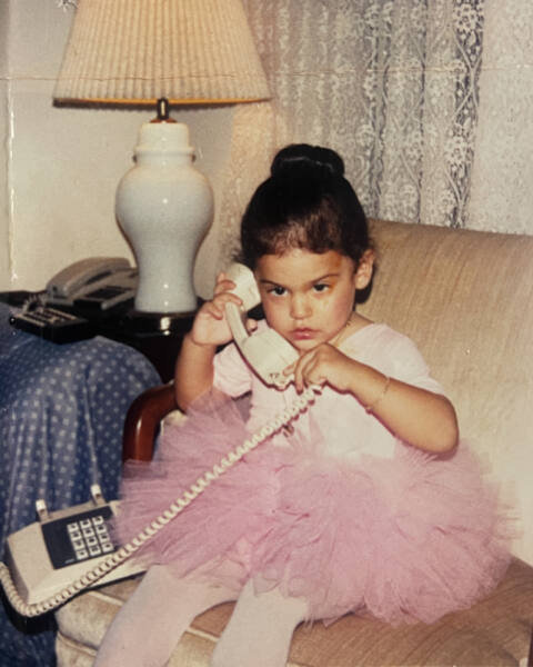 Writer Jeanine Romo as a toddler on the phone