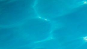 woman tanning at pool