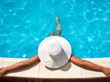 woman tanning at pool
