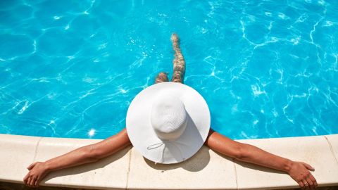 woman tanning at pool