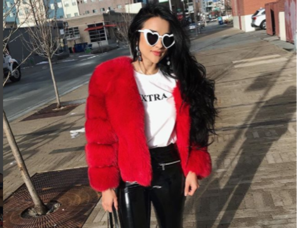 Stylish Latina Woman in Black Leather Ensemble and High Heels