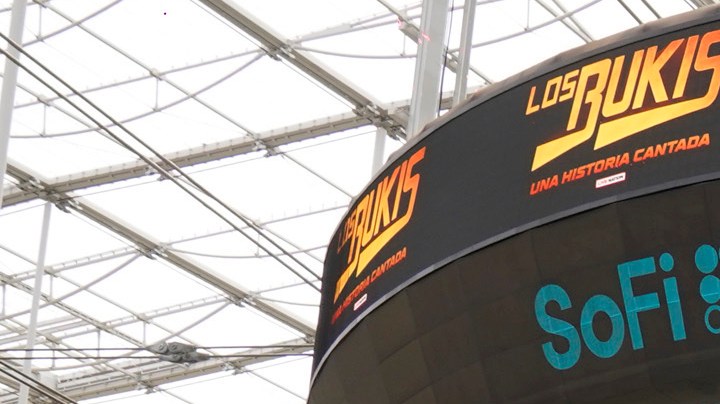 Members of the Mexican grupera band Los Bukis, from left, Pedro Sanchez, Roberto Guadarrama, Marco Antonio Solis, on screen Joel Solis and Pepe Guadarrama, and Eusebio "El Chivo" Cortez and Jose Javier Solis attend a press conference at SoFi Stadium on Monday, June 14, 2021, in Inglewood, Calif. Twenty five years after their last show as a band, the group announced that they are reuniting for a U.S. tour. (AP Photo/Chris Pizzello)