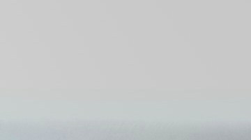 A braider at Eve's African Braiding in College Park, Ga., feeds in synthetic braiding hair while styling client Sadajah Herring's hair into knotless braids, Tuesday, May 6, 2025. (AP Photo/Stephanie Scarbrough)