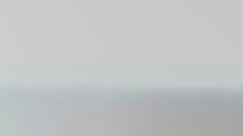 A braider at Eve's African Braiding in College Park, Ga., feeds in synthetic braiding hair while styling client Sadajah Herring's hair into knotless braids, Tuesday, May 6, 2025. (AP Photo/Stephanie Scarbrough)